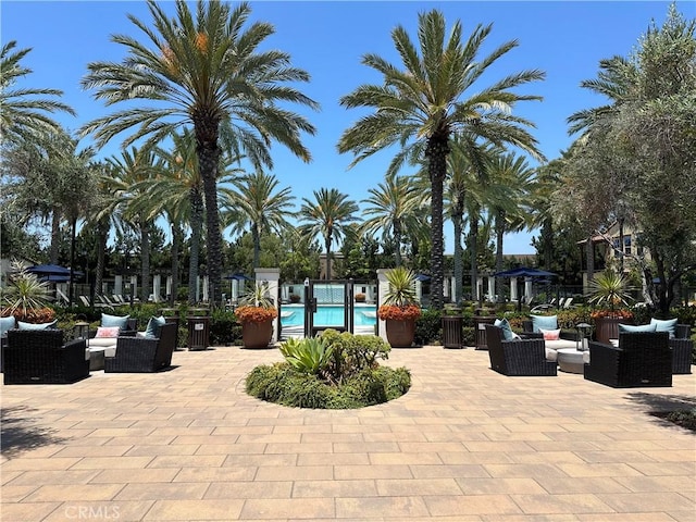 227 Carlow, Irvine, CA 92618 - view of property's community with a pool, outdoor lounge area, and a patio area