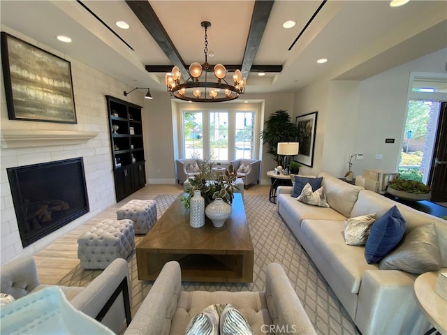 227 Carlow, Irvine, CA 92618 - living room featuring a chandelier, recessed lighting, healthy amount of natural light, a fireplace, and beam ceiling