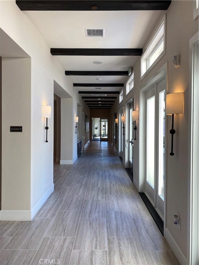 227 Carlow, Irvine, CA 92618 - corridor featuring beam ceiling and baseboards