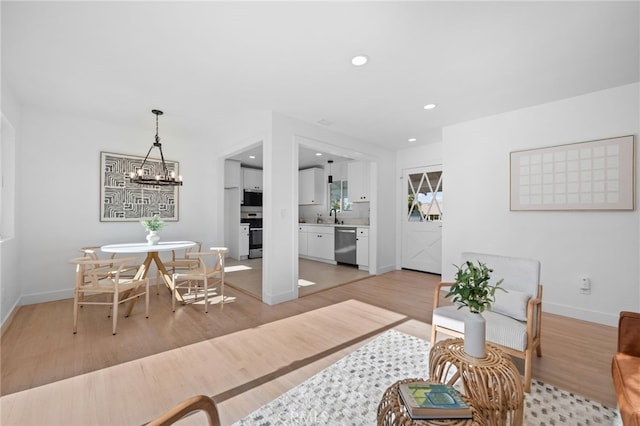 676 Alvin St, San Diego, CA 92114 - living area featuring a chandelier, light wood-type flooring, and recessed lighting