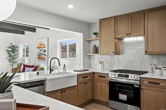 6863 Tanglewood Rd, San Diego, CA 92111 - kitchen featuring stainless steel range with gas cooktop, dishwasher, backsplash, open shelves, and light stone countertops