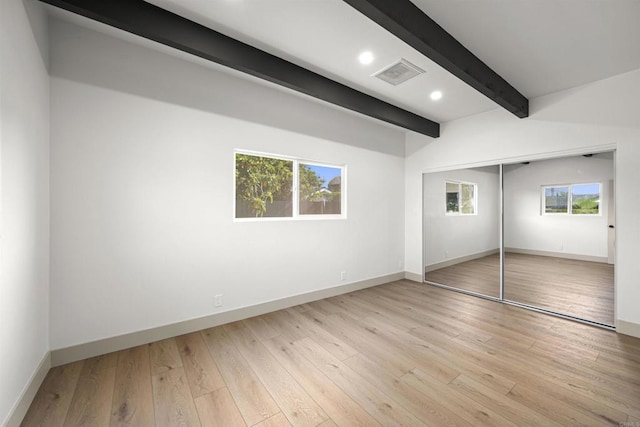 6863 Tanglewood Rd, San Diego, CA 92111 - unfurnished bedroom featuring beamed ceiling, recessed lighting, light wood finished floors, and a closet