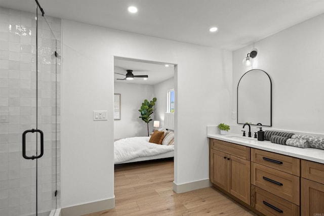 6863 Tanglewood Rd, San Diego, CA 92111 - ensuite bathroom featuring a stall shower, vanity, recessed lighting, wood finished floors, and a ceiling fan