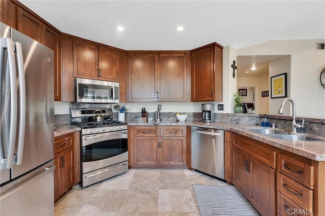 15736 Milne Cir, Moorpark, CA 93021 - kitchen featuring appliances with stainless steel finishes, light stone countertops, brown cabinetry, recessed lighting, and light stone finish floors