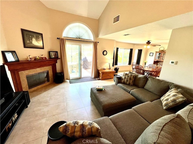 27347 Sahara Pl, Laguna Niguel, CA 92677 - living room featuring light tile patterned floors, a premium fireplace, a ceiling fan, and high vaulted ceiling