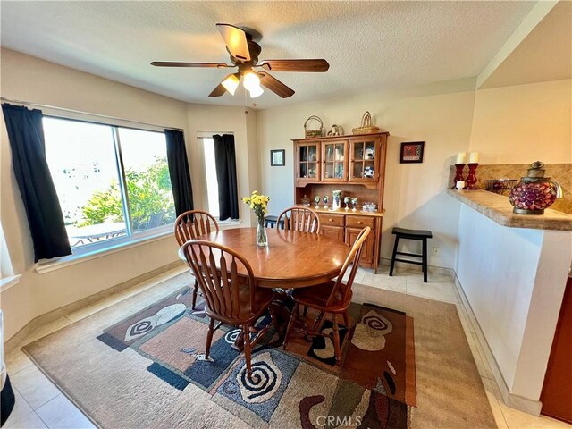 27347 Sahara Pl, Laguna Niguel, CA 92677 - dining space featuring a ceiling fan, light tile patterned floors, and a textured ceiling