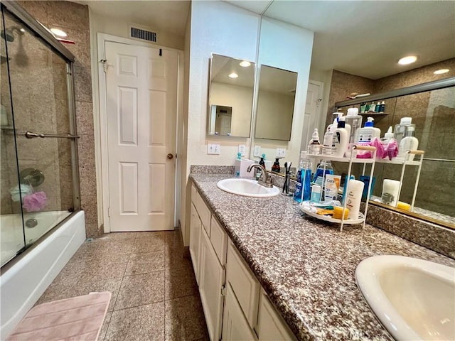 27347 Sahara Pl, Laguna Niguel, CA 92677 - bathroom featuring double vanity, shower / bath combination with glass door, granite floors, and recessed lighting