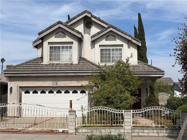220 N Ynez Ave, Monterey Park, CA 91754 - ranch-style home featuring stucco siding, an attached garage, and a tile roof