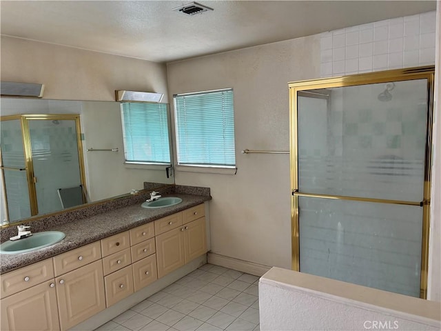 220 N Ynez Ave, Monterey Park, CA 91754 - bathroom with a shower stall, tile patterned floors, double vanity, and a textured ceiling