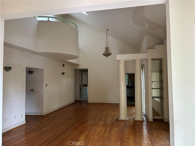 220 N Ynez Ave, Monterey Park, CA 91754 - unfurnished living room featuring wood finished floors, ornate columns, and high vaulted ceiling