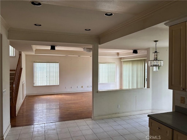 220 N Ynez Ave, Monterey Park, CA 91754 - unfurnished dining area featuring light tile patterned floors, crown molding, stairs, and a chandelier
