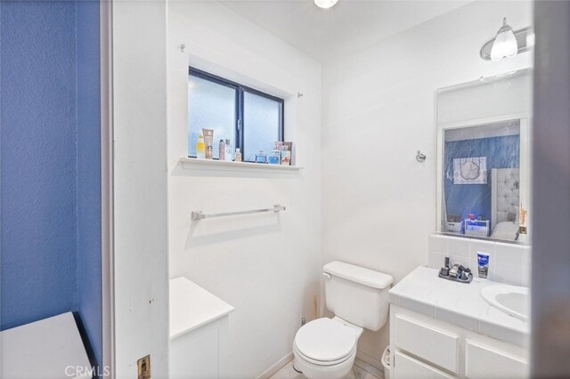 33030 Rd 233, North Fork, CA 93643 - bathroom with vanity and backsplash