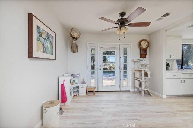 33030 Rd 233, North Fork, CA 93643 - doorway to outside with light wood finished floors and ceiling fan