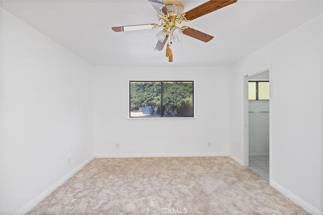 33030 Rd 233, North Fork, CA 93643 - carpeted empty room featuring ceiling fan and baseboards