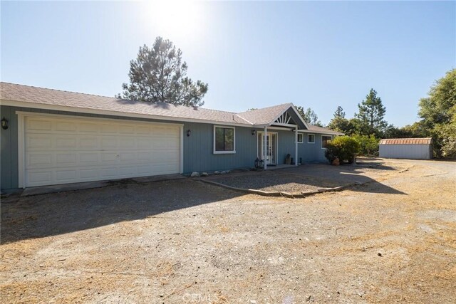 33030 Rd 233, North Fork, CA 93643 - single story home with a garage and dirt driveway