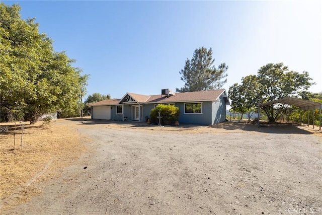 33030 Rd 233, North Fork, CA 93643 - ranch-style home with driveway, a carport, and a garage