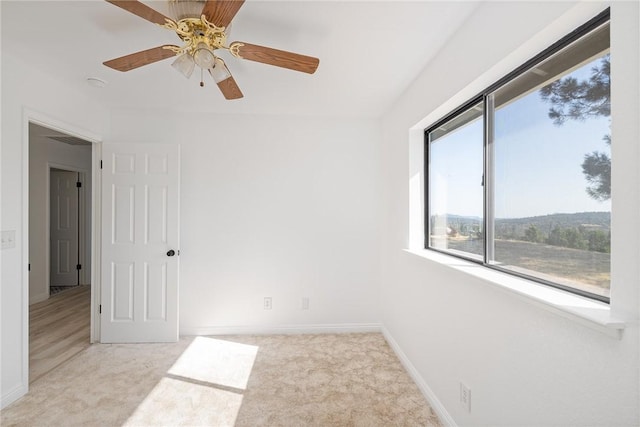 33030 Rd 233, North Fork, CA 93643 - unfurnished room featuring light carpet and a ceiling fan