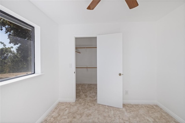 33030 Rd 233, North Fork, CA 93643 - unfurnished bedroom with carpet floors, a spacious closet, a ceiling fan, and a closet