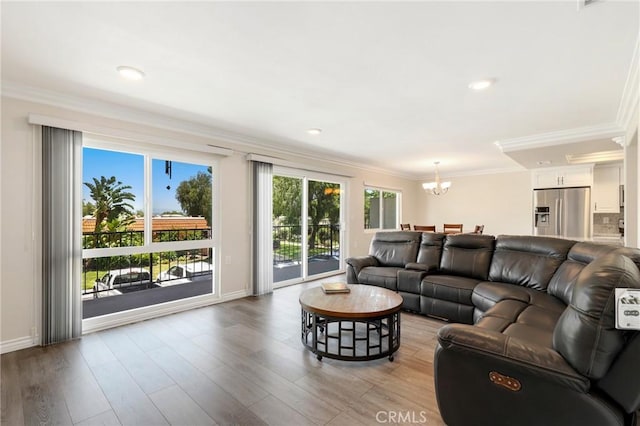 3034 Via Vis Unit A, Laguna Woods, CA 92637 - living room with a chandelier, ornamental molding, light wood-style floors, and recessed lighting