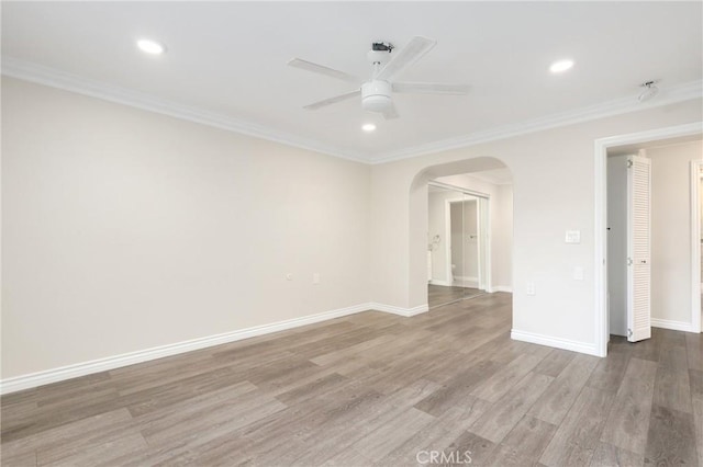 3034 Via Vis Unit A, Laguna Woods, CA 92637 - spare room featuring ceiling fan, arched walkways, crown molding, wood finished floors, and recessed lighting