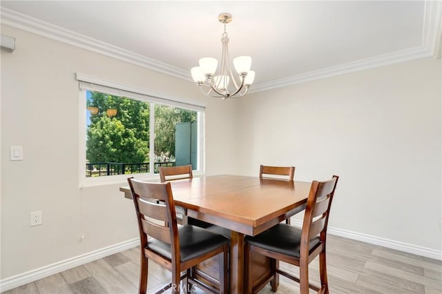 3034 Via Vis Unit A, Laguna Woods, CA 92637 - dining area with a chandelier, light wood-style flooring, and ornamental molding