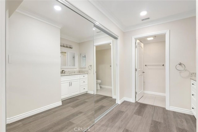 3034 Via Vis Unit A, Laguna Woods, CA 92637 - full bath with vanity, wood finished floors, crown molding, and recessed lighting