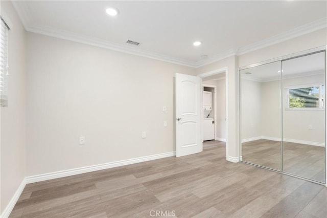 3034 Via Vis Unit A, Laguna Woods, CA 92637 - unfurnished bedroom with light wood-type flooring, recessed lighting, ornamental molding, and a closet