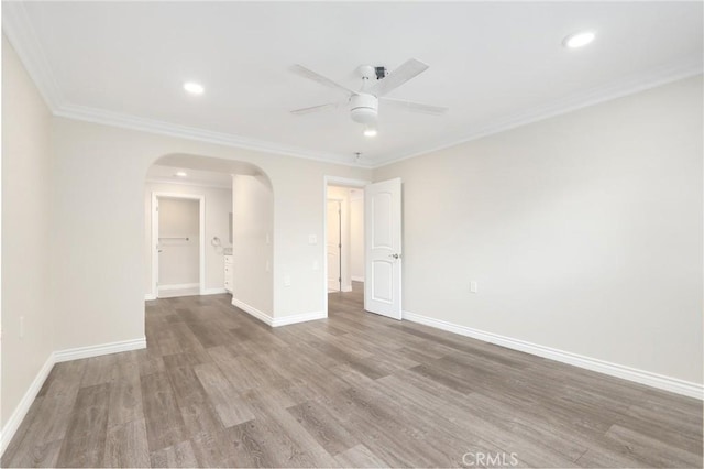 3034 Via Vis Unit A, Laguna Woods, CA 92637 - unfurnished room featuring arched walkways, ceiling fan, wood finished floors, recessed lighting, and crown molding