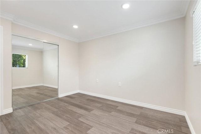 3034 Via Vis Unit A, Laguna Woods, CA 92637 - unfurnished bedroom featuring ornamental molding, wood finished floors, recessed lighting, and a closet
