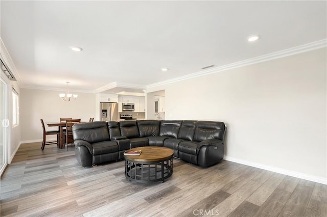 3034 Via Vis Unit A, Laguna Woods, CA 92637 - living area with a chandelier, light wood-style floors, crown molding, and recessed lighting
