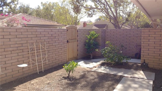 17305 Rosewood, Irvine, CA 92612 - view of yard featuring a gate