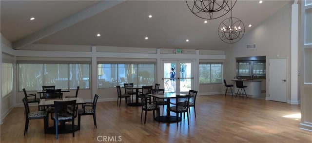 17305 Rosewood, Irvine, CA 92612 - dining room featuring high vaulted ceiling, a chandelier, french doors, wood finished floors, and recessed lighting