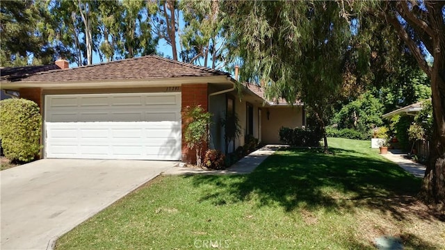 17305 Rosewood, Irvine, CA 92612 - view of home's exterior featuring a yard, driveway, and a garage