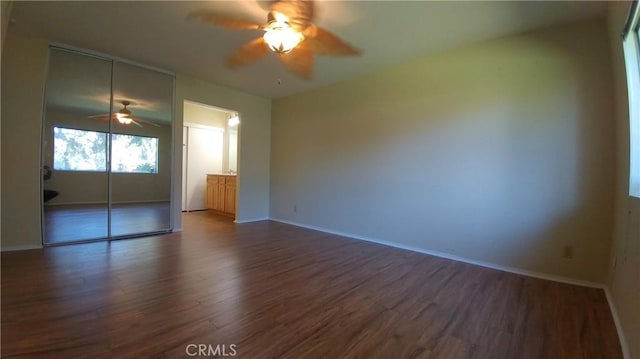 17305 Rosewood, Irvine, CA 92612 - unfurnished bedroom with dark wood-style flooring and ceiling fan