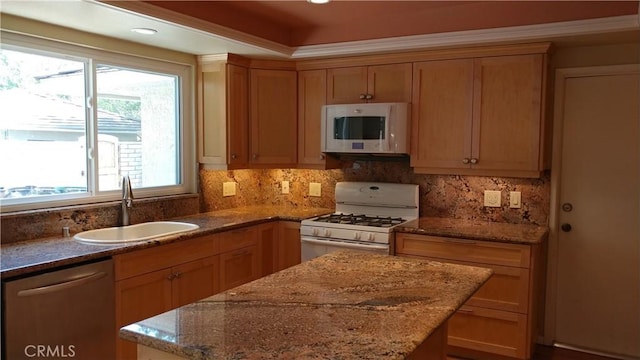 17305 Rosewood, Irvine, CA 92612 - kitchen featuring white appliances, a center island, stone countertops, and decorative backsplash