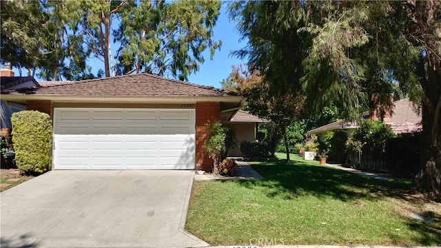 17305 Rosewood, Irvine, CA 92612 - view of front of property featuring driveway, a front lawn, and an attached garage