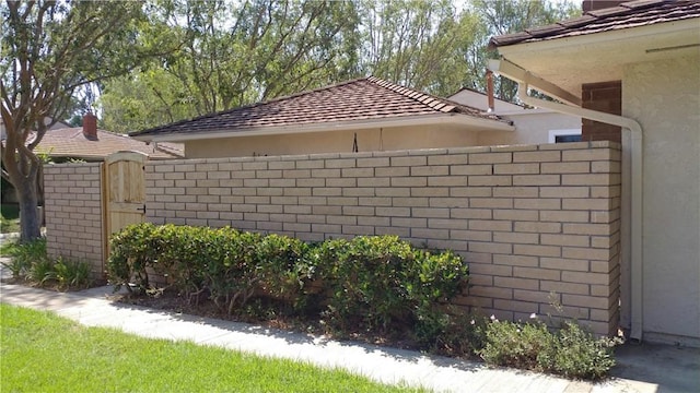 17305 Rosewood, Irvine, CA 92612 - view of side of home featuring stucco siding