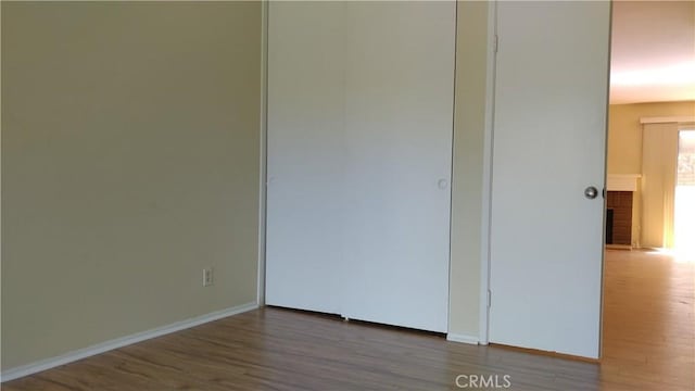 17305 Rosewood, Irvine, CA 92612 - unfurnished bedroom featuring wood finished floors