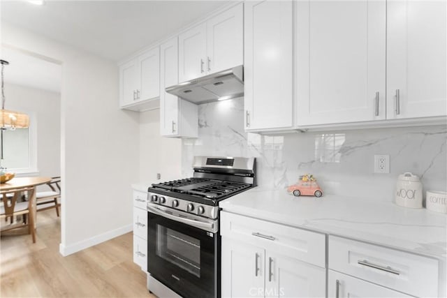16627 E Greenhaven St, Covina, CA 91722 - kitchen featuring stainless steel gas range, under cabinet range hood, white cabinetry, tasteful backsplash, and light wood-style floors