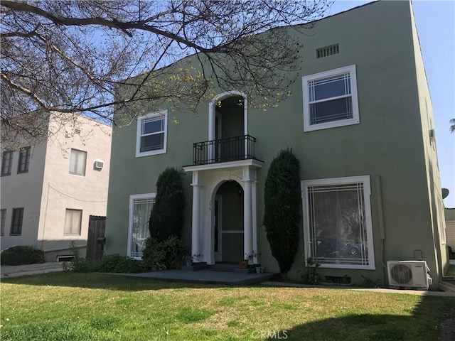 254 E Glenarm St, Pasadena, CA 91106 - mediterranean / spanish-style home with a balcony, stucco siding, and a front yard