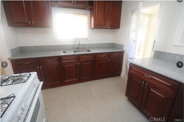 254 E Glenarm St, Pasadena, CA 91106 - kitchen featuring white range with gas cooktop, plenty of natural light, light countertops, and tasteful backsplash