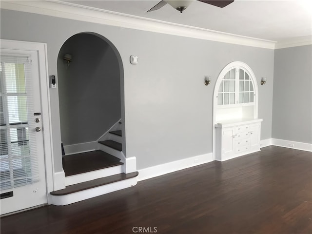 254 E Glenarm St, Pasadena, CA 91106 - unfurnished room featuring crown molding, dark wood-style flooring, ceiling fan, arched walkways, and stairs