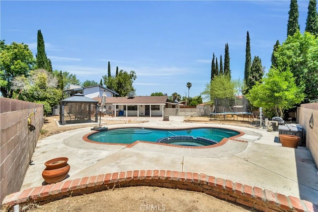 2528 Key Ct, Lancaster, CA 93536 - view of pool featuring a gazebo, a patio, a trampoline, a fenced backyard, and a pool with connected hot tub