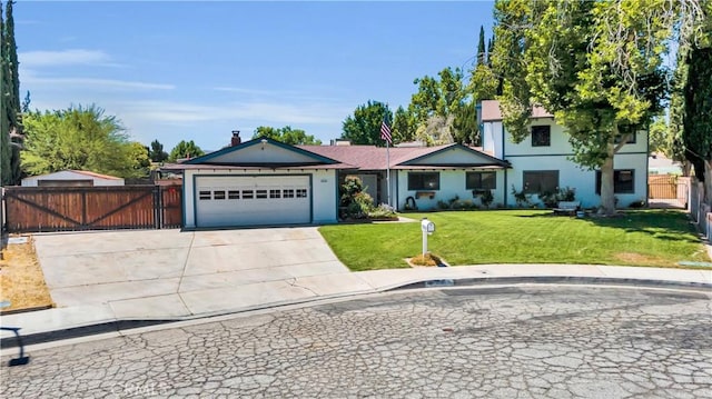 2528 Key Ct, Lancaster, CA 93536 - view of front of home featuring a garage, concrete driveway, and stucco siding