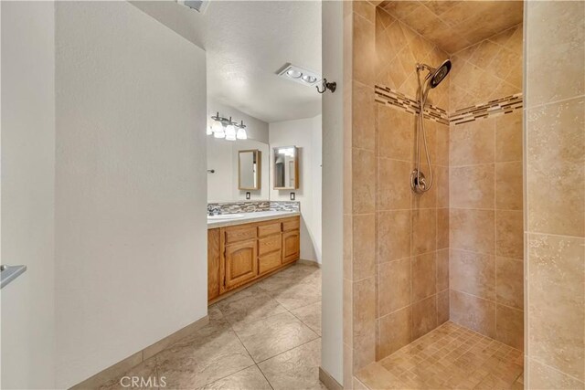 2528 Key Ct, Lancaster, CA 93536 - full bathroom featuring double vanity, tiled shower, and tile patterned flooring