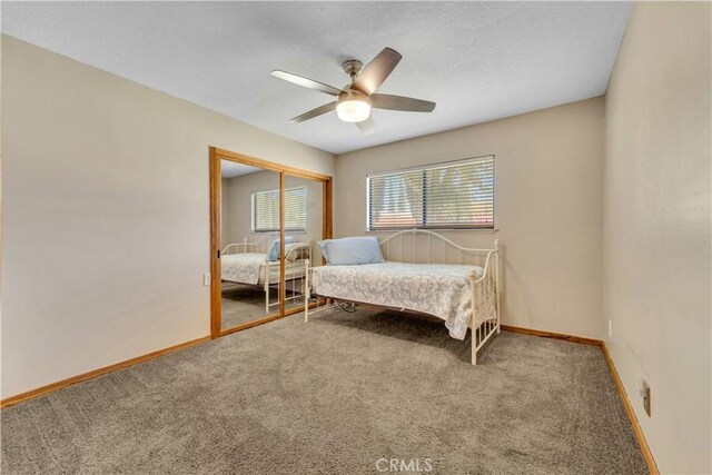 2528 Key Ct, Lancaster, CA 93536 - bedroom featuring carpet flooring, a closet, a ceiling fan, and a textured ceiling