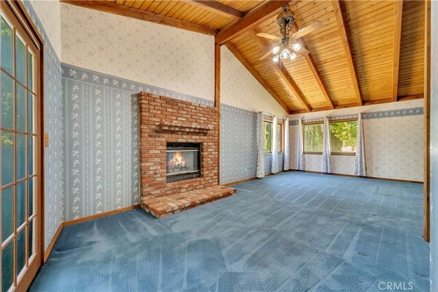 2528 Key Ct, Lancaster, CA 93536 - unfurnished living room featuring wallpapered walls, carpet floors, ceiling fan, a fireplace, and a wooden ceiling with exposed beams