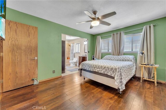 2528 Key Ct, Lancaster, CA 93536 - bedroom featuring wood-type flooring, a textured ceiling, ceiling fan, and connected bathroom