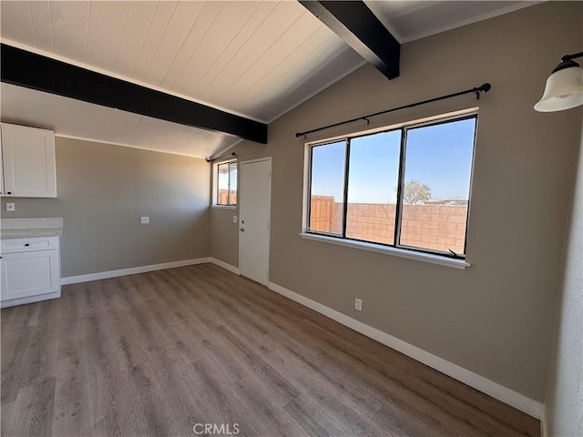 541 Frances Dr, Barstow, CA 92311 - unfurnished living room with wood finished floors and wood ceiling