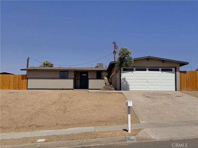 541 Frances Dr, Barstow, CA 92311 - ranch-style house with concrete driveway and a garage